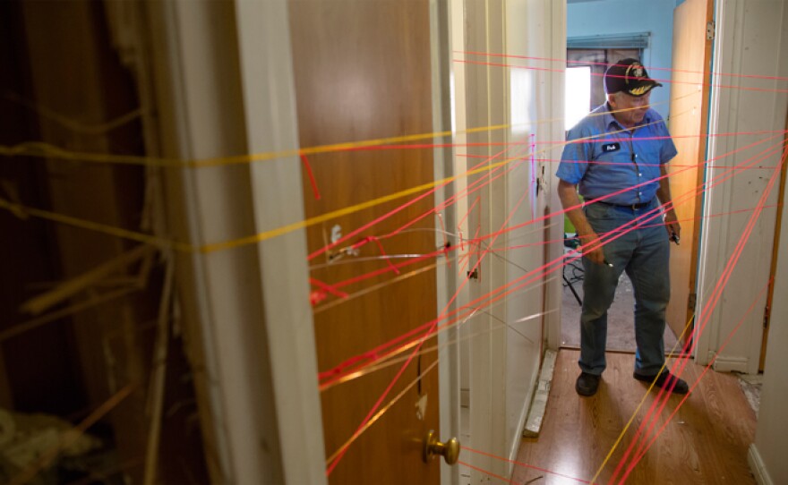 Dub Lawrence investigates shooting at Matthew Stewart's home. The red strings represent bullets fired by police, the yellow represent bullets fired by Matthew Stewart.