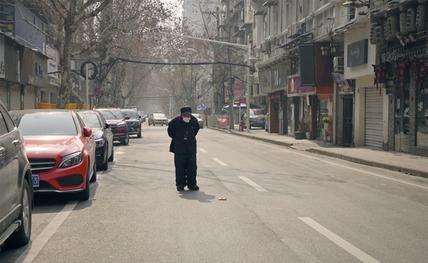 Old man on deserted street.