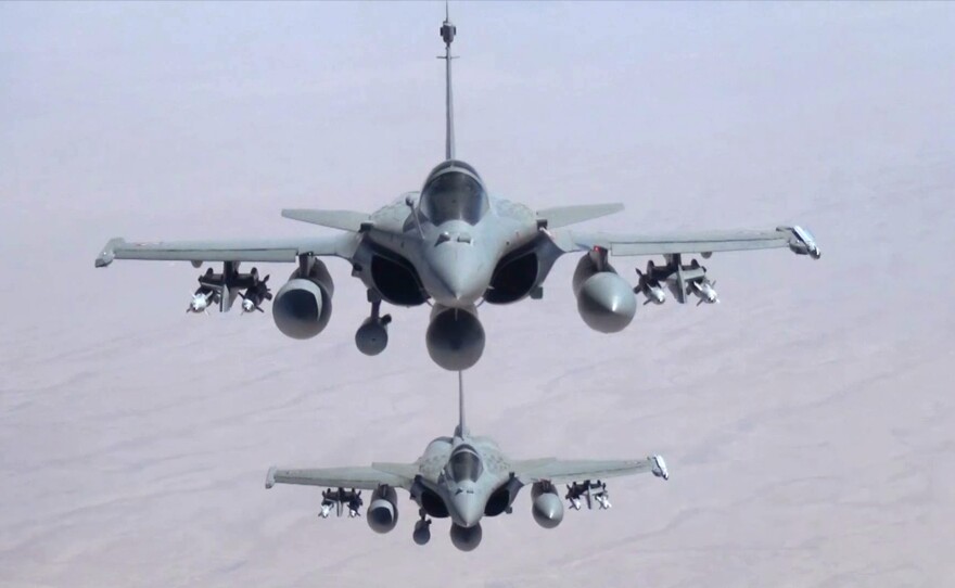 A remote camera screen grab provided by the French Army shows two Rafale jet fighters flying over Iraq on Friday. French President Francois Hollande announced that the fighters had carried out their first airstrikes in northern Iraq.