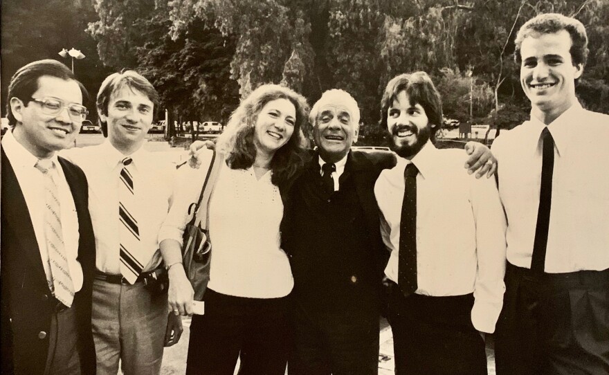 Doug Hall is shown standing next to Leonard Bernstein and other members of the LA Philharmonic Institute in Los Angeles in this photo from 1982.