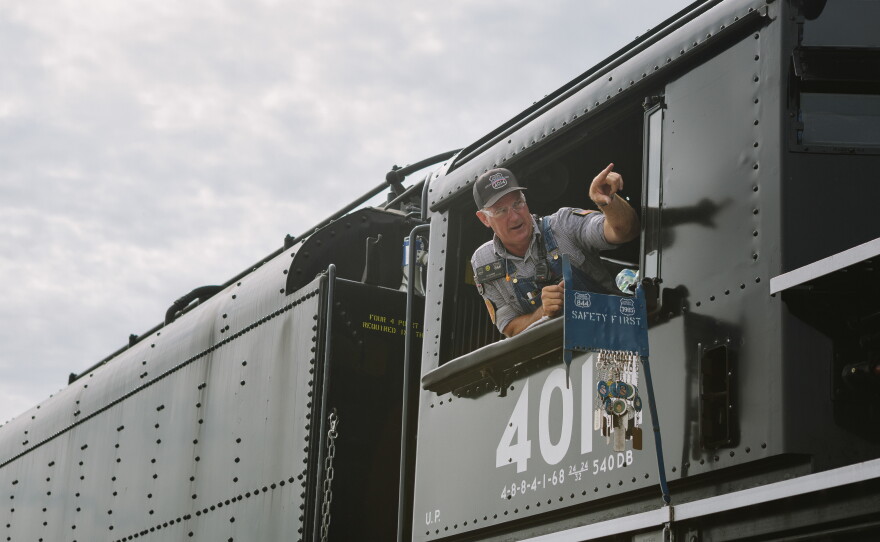 Ed Dickens, the senior manager of Union Pacific Heritage Operations, looks out to the crowd of attendees from Union Pacific's Big Boy No. 4014, the world's largest operating steam engine locomotive, during a stop in Philadelphia. Dickens is the head the steam program at Union Pacific, and was responsible for the leading the team to restore Big Boy No. 4014.