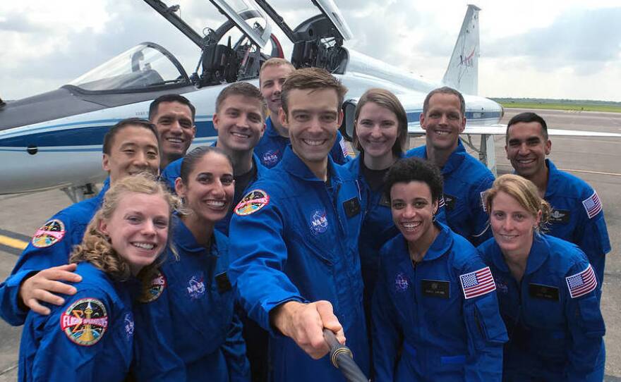 NASA's 2017 astronaut candidates round up for a group photo on Tuesday at Ellington Field near Johnson Space Center. The 12 pictured are, front row, left to right, Zena Cardman, Jasmin Moghbeli, Robb Kulin, Jessica Watkins, Loral O'Hara; back row, left to right, Jonny Kim, Frank Rubio, Matthew Dominick, Warren Hoburg, Kayla Barron, Bob Hines and Raja Chari.