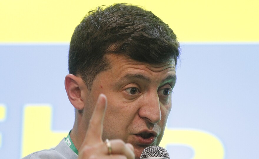 Ukrainian President Volodymyr Zelensky speaks at his the 'Servant of the People' political party's headquarters after the parliamentary elections in Kiev, Ukraine, on Sunday.
