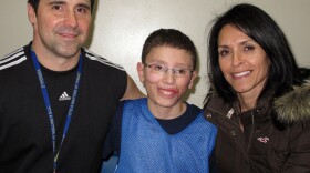 Jake Finkbonner, shown with his father, Donny, and mother, Elsa, nearly died after contracting a flesh-eating bacterium. His family and friends prayed for a miracle, and now the Vatican is investigating whether one actually occurred.