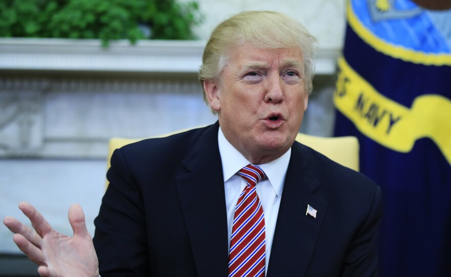 President Trump speaks in the Oval Office Wednesday during a working session regarding the opportunity zones provided by the new tax law.