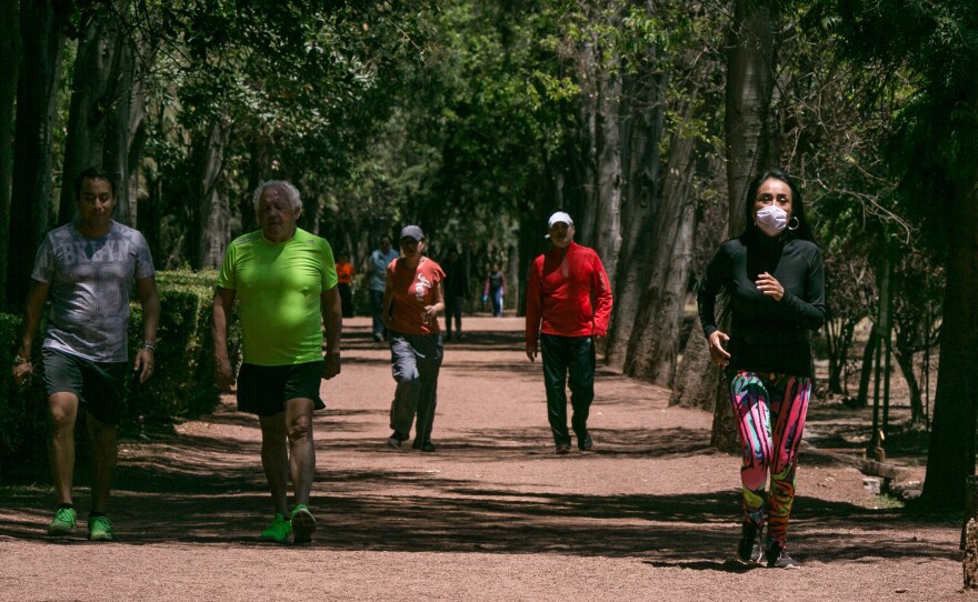 Runners in the wooded park of Viveros in Coyoacan, Mexico City. Mexico City has few runner-friendly spaces. The altitude discourages exertion and the air quality is often so bad some runners wear face masks. Yet health officials urge people to exercise more.