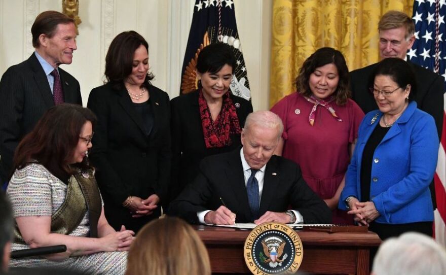 President Biden signs into law the COVID-19 Hate Crimes Act in the East Room of the White House on Thursday.