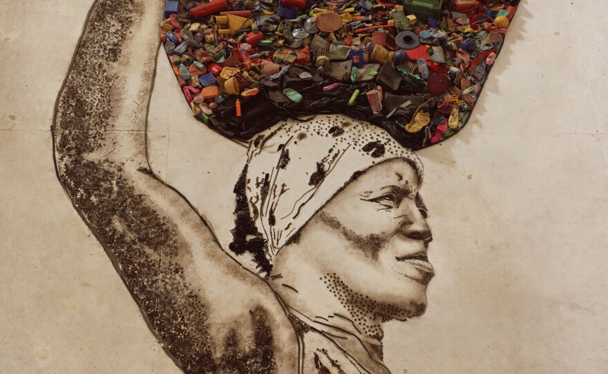 A portrait of a garbage picker from Brazil by internationally acclaimed artist Vik Muniz.