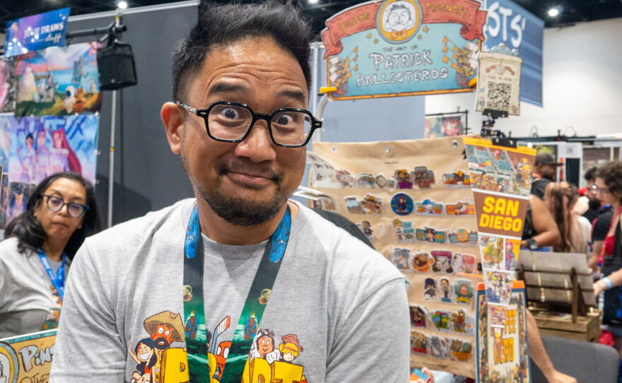 Patrick Ballesteros poses for a photo in front of his Comic-Con booth on July 23, 2026.
