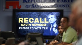 People listen during a meeting of volunteers to get out the vote by supporters of the effort to recall California Gov. Gavin Newsom at the San Diego Republican Party Headquarters, Monday, Sept. 13, 2021, in San Diego.