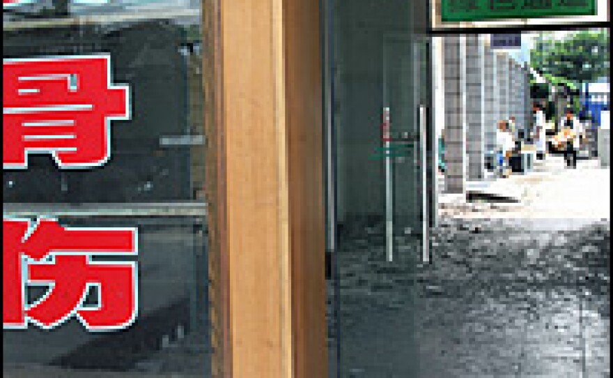 A damaged hospital in Han Wang, though standing, has been abandoned since the May 12 quake.
