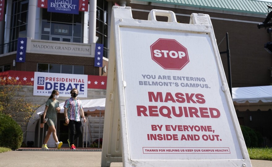 In Nashville, Tenn., a sign reminds visitors to wear masks at Belmont University, which is preparing to host Thursday's presidential debate. Federal health officials say a new study highlights the need for masks.