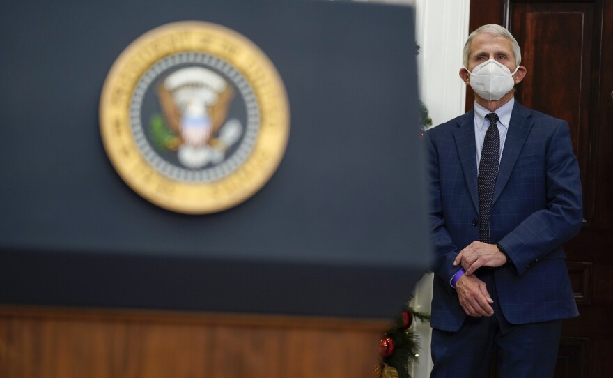 Dr. Anthony Fauci, director of the National Institute of Allergy listens as President Joe Biden speaks about the COVID-19 variant named omicron, in the Roosevelt Room of the White House, Monday, Nov. 29, 2021, in Washington.