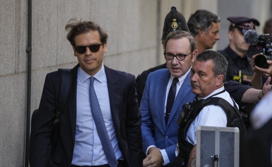 Actor Kevin Spacey, center, arrives at the Old Bailey in London on Thursday. He pleaded not guilty to charges of sexually assaulting three men years ago.