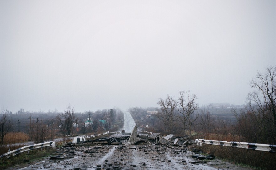 The road through Dolyna, near Slovyansk, a village that was razed to the ground after many months on the front line between Russian and Ukrainian forces. December 2022.