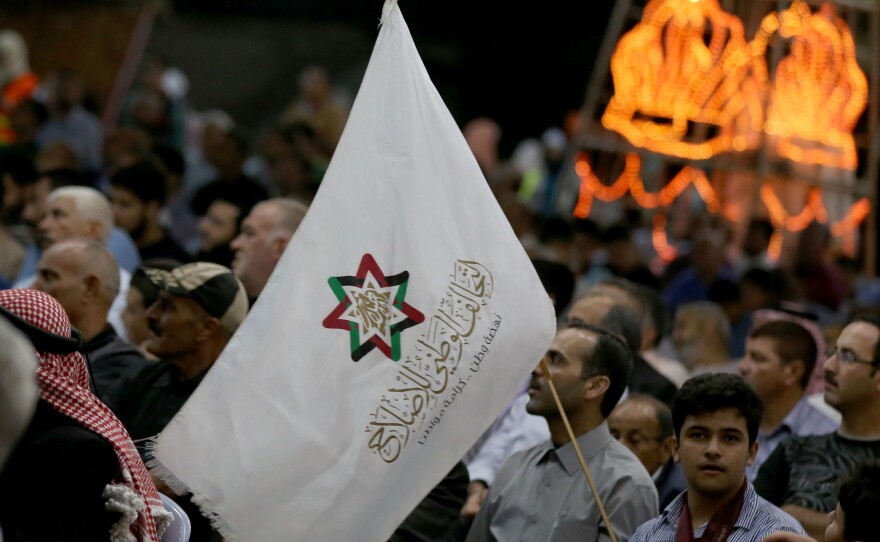 Supporters attend a gathering for Jordan's National Alliance for Reform, a political bloc including the Muslim Brotherhood, in Amman's Sweileh district last September. "In a lot of countries, we are in partnership with governments and parliament," says a Brotherhood spokesman in Amman.