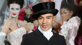 FILE - Fashion designer John Galliano poses at the end of the presentation of the Dior Haute Couture spring/summer 2010 fashion collection on Jan. 25, 2010, in Paris.