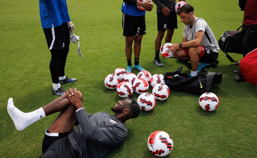 Sacramento Republic FC player Luther Archimède stretches after practice.