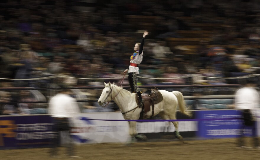A member of the Westernaires performs tricks during the Mexican Rodeo Extravaganza in Denver, Colo.