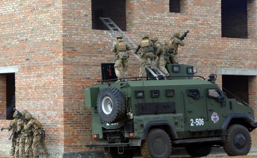 Soldiers storm a building during a drill held as part of the Exercise Rapid Trident 2019, an annual multinational training exercise near Yavoriv, Ukraine.