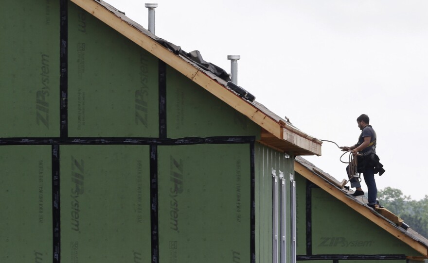 A roofer works on a home in Chapel Hill, N.C.  A rebound in spending on home remodeling is a good sign for the U.S. economy. But a shortage of skilled workers is restraining activity.
