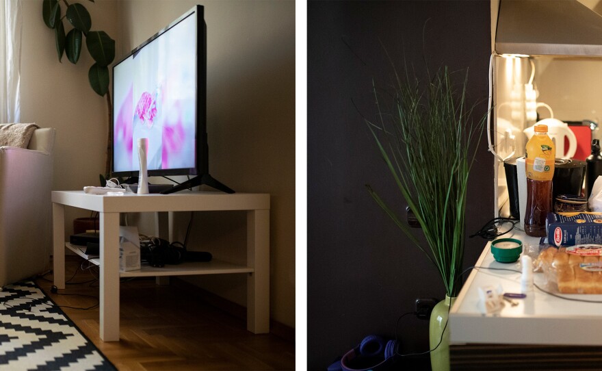 Left: Julija Nykolyn watches TV at their apartment in Sofia, Bulgaria, on Friday. Right: Natasha Nykolyn takes out groceries at their apartment in Sofia, Bulgaria, on Friday.