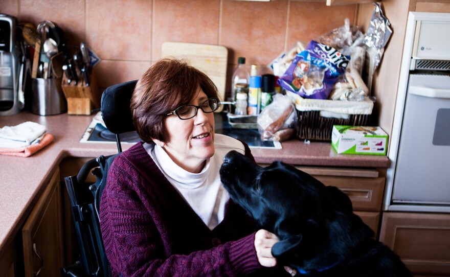 Treston with her service dog, Finn, at her home.