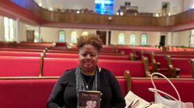 Lisa McNair holds her memoir <em>Dear Denise: Letters to the Sister I Never Knew</em>, recounting growing up in Birmingham, Ala., after her sister Denise and three other Black girls were murdered in the Ku Klux Klan bombing of 16th Street Baptist Church.