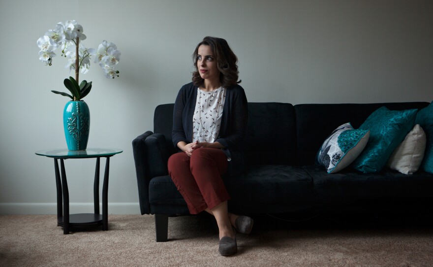 Hala al-Dosari, a visiting scholar at Johns Hopkins University from Saudi Arabia, poses for a portrait in her living room on Dec. 2, at her apartment in Baltimore.