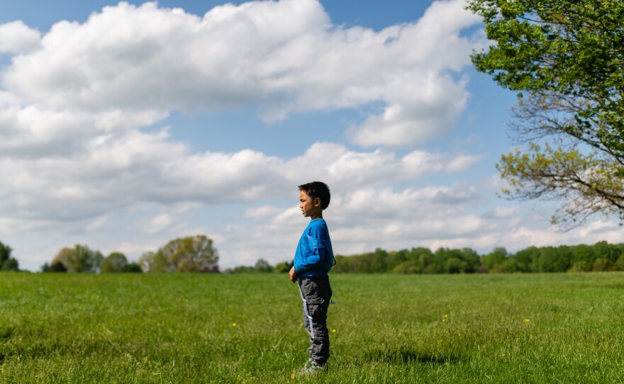 Henry watches his friends play football at Hayle's birthday on April 28, 2019 in Darnestown, Md.