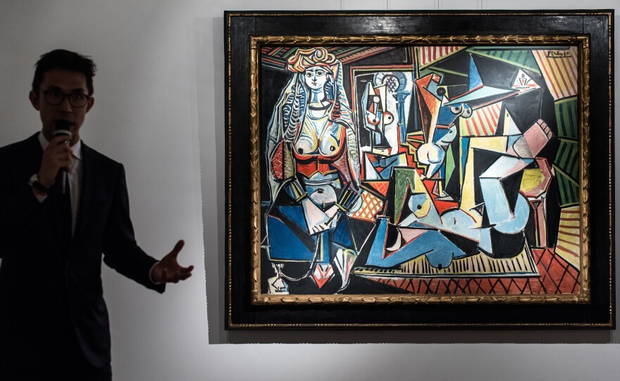 In 1997, Pablo Picasso's Women of Algiers (Version O) — shown here at Christie's in Hong Kong — was part of a groundbreaking art auction that sent prices soaring.