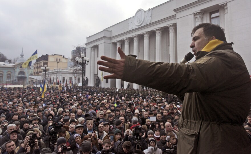 Saakashvili addresses his supporters after escaping from law enforcement and leading them on a march toward the Parliament building in Kiev on Tuesday.