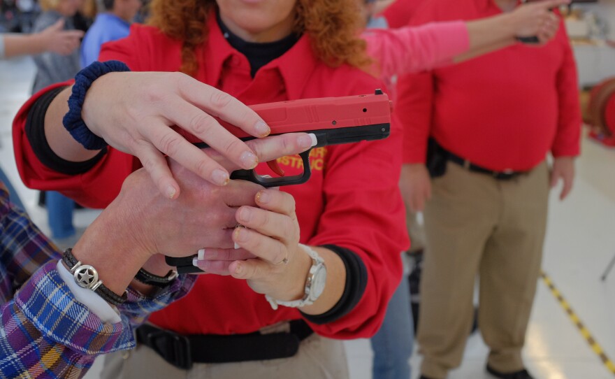 Colorado educators take part in a concealed carry course in Englewood, Colo. on Nov. 8, open to all state school employees. Participants who complete the training are eligible to apply for a permit to carry a handgun.