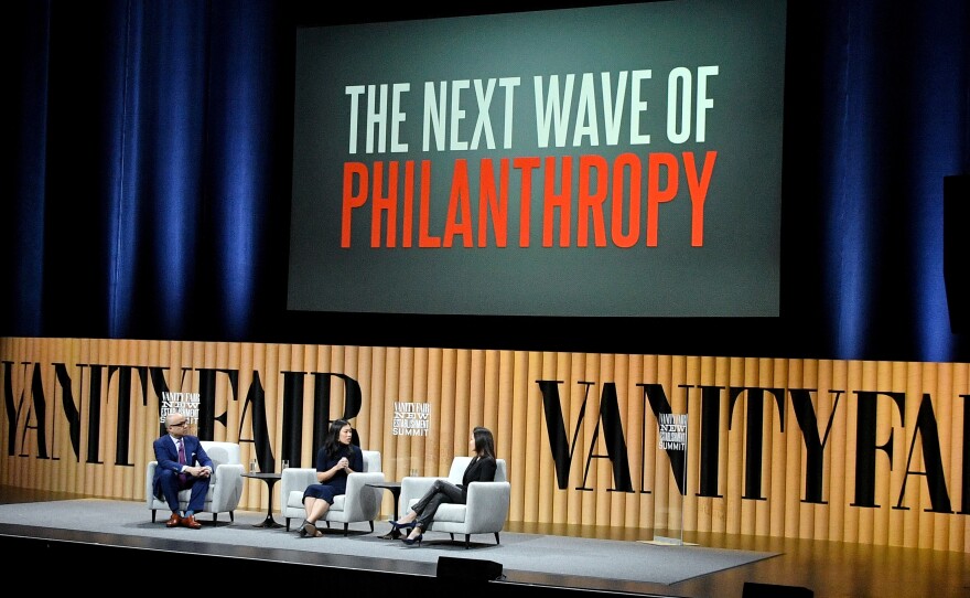 Ford Foundation President Darren Walker, Chan Zuckerberg Initiative co-founder Priscilla Chan and Goldman Sachs Foundation President Dina Powell speak during the Vanity Fair New Establishment Summit in 2016 in San Francisco.
