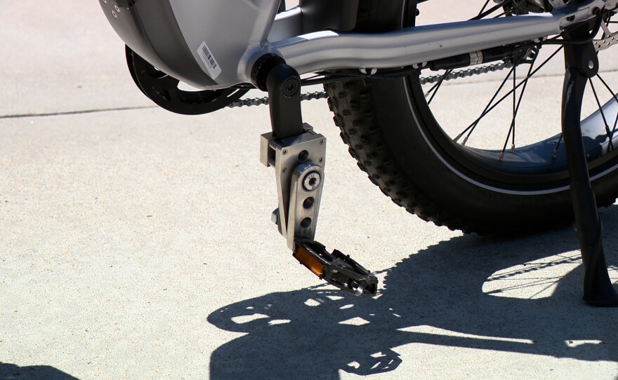 A stainless steel pedal on an e-bike that allows Marine veteran Josh Doyle to pedal with his left leg despite a limited range of motion.