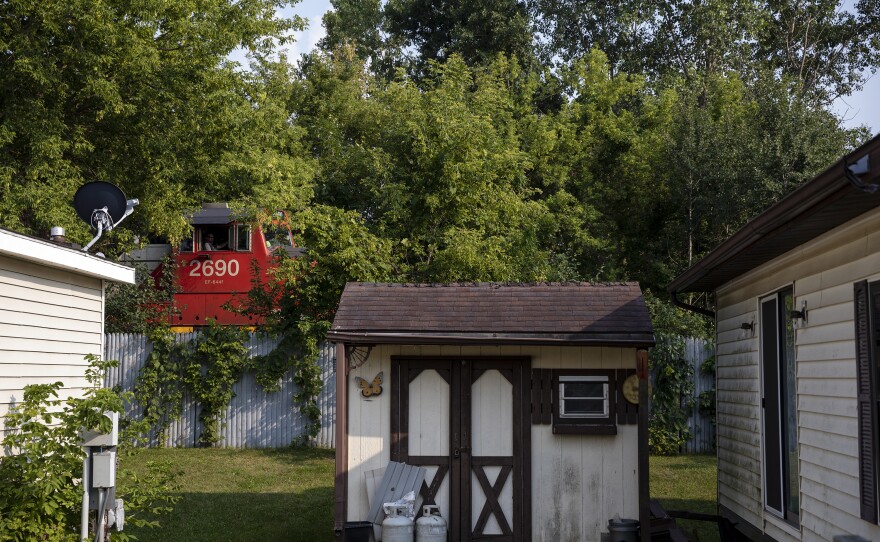 A train passes right behind Mary Hunt's home on Wednesday, Aug. 4, 2021 in Swartz Creek, Mich.