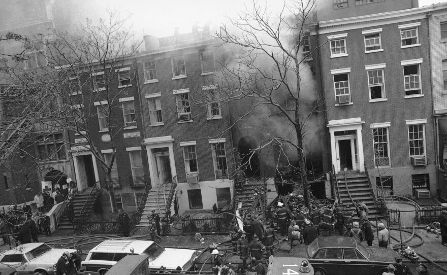 New York City firefighters work to put out a fire caused by explosions at 18 W. 11th St. on March 6, 1970. It was later discovered that the Weathermen, a radical left-wing organization, had been building bombs in the building's basement.