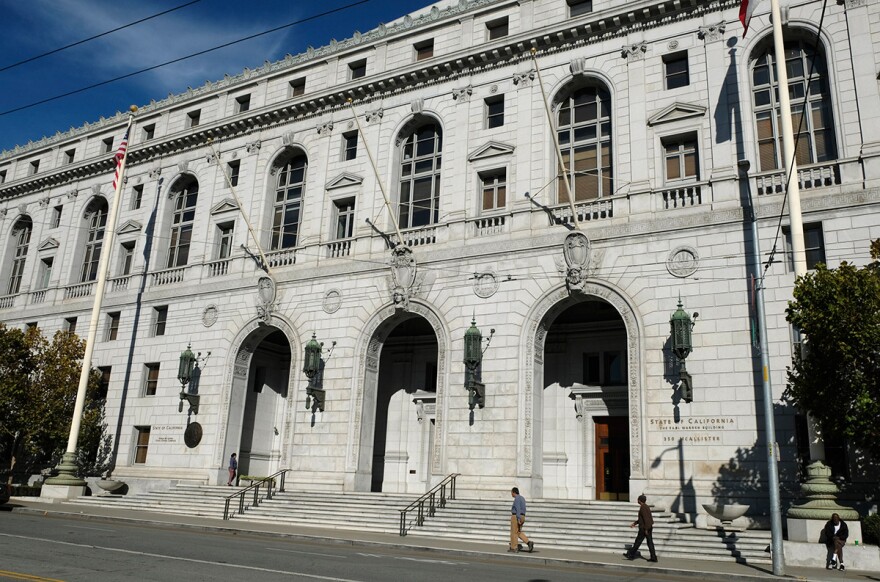 In this Nov. 2, 2018, file photo, people walk past the Earl Warren Building that houses the California Supreme Court in San Francisco.