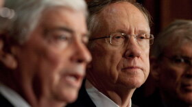 Majority Leader Harry Reid of Nevada listens as Connecticut Sen. Christopher Dodd (left) speaks during a Democratic health care rally on Capitol Hill on Tuesday.