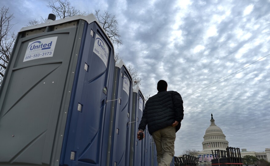 Portable toilets are installed around the U.S. Capitol in preparation for Monday's inauguration. A new app this year will help the crowd follow the event — and even find the closest port-a-potty.