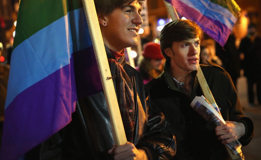 Nathaniel Iovinelli (left) and Ted Daisher join other supporters of same-sex marriage at a rally in Chicago to celebrate the Illinois General Assembly's passing of the gay marriage bill on Nov. 7.