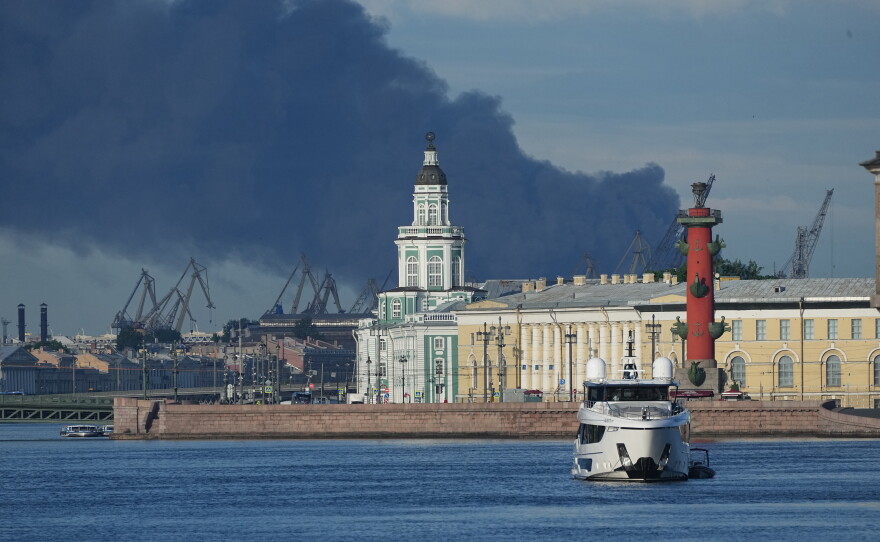 A plumes of black smoke is seen over the port of St. Petersburg, Russia, Wednesday, June 3, 2026, after a Ukrainian drone attack.