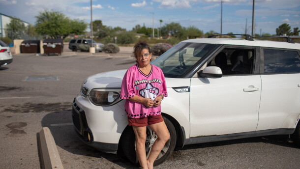 Tara Gentner stands next to the car she inherited from her mother, Sheri Petty. Petty died last summer after exposure to extreme heat. Gentner found her mother passed out on the floor of their manufactured home in sweltering July temperatures.