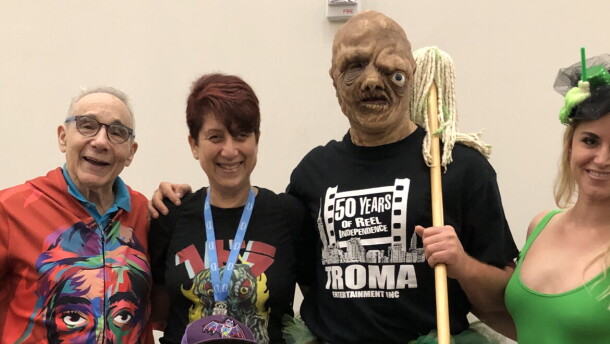 Troma founder and president Lloyd Kaufman with KPBS arts reporter Beth Accomando, Toxie, and Kristy Rose. July 25, 2025
