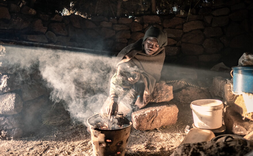 Khotso Rants'etile, 22, who has been working as a herder since the age of nine, prepares breakfast in his isolated cattle post in the mountains of Mokhotlong District, Lesotho.