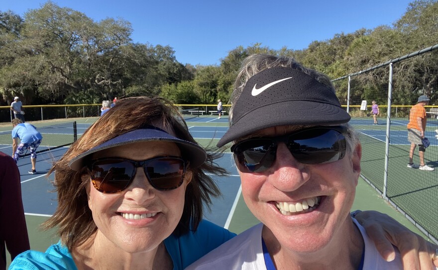 Debbie and her husband on the pickleball court.