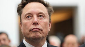 Elon Musk listens as President Donald Trump speaks during an event at the U.S. Institute of Peace, Oct. 8, 2026, in Washington.