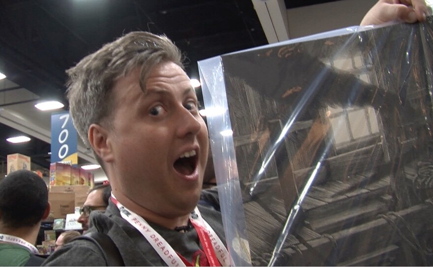 Filmmaker Stephen W. Martin proudly shows off his Mondo "Jaws" poster that he successfully purchased. He was not so lucky at the Hasbro booth.