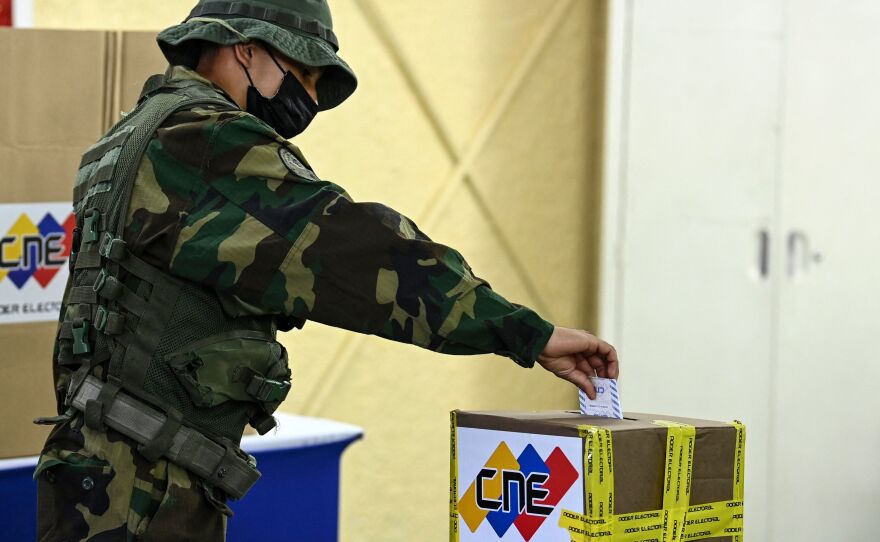 A member of the Bolivarian National Guard votes at a polling station during regional and municipal elections in Fort Tiuna in Caracas, on Nov. 21.
