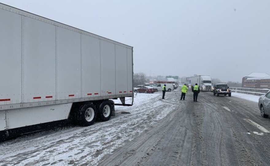 Tennessee Highway Patrol officers respond to a crash on Interstate 65 involving seven passenger cars and two commercial vehicles.